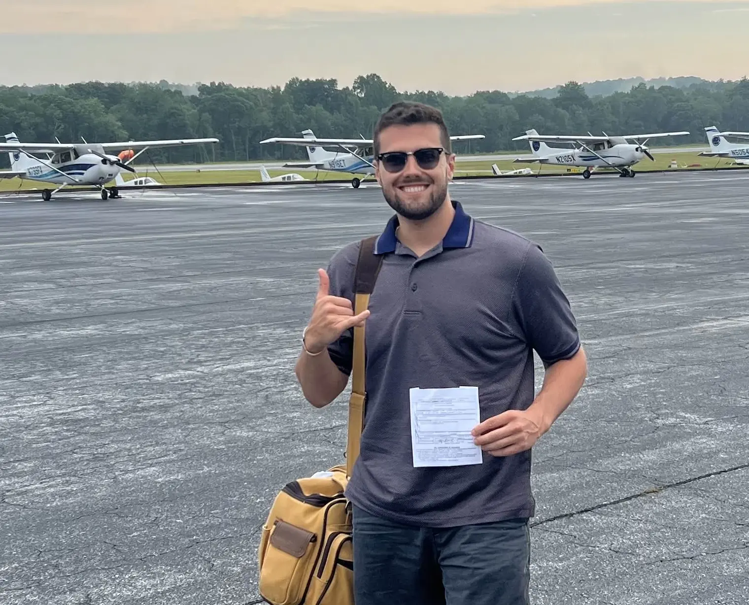 Student pilot celebrating first solo flight